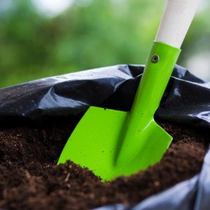 shovel-inside-soil-bag_23-2148175878